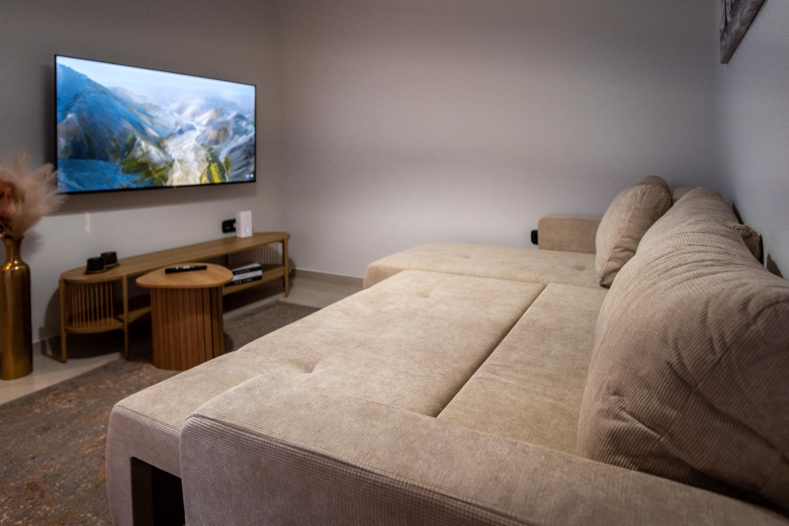 Large sofa and television in the suite living room