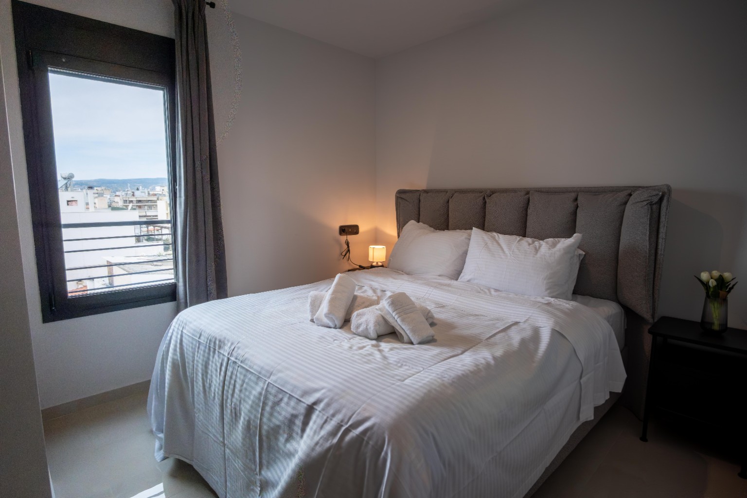 Comfortable bedroom with city view